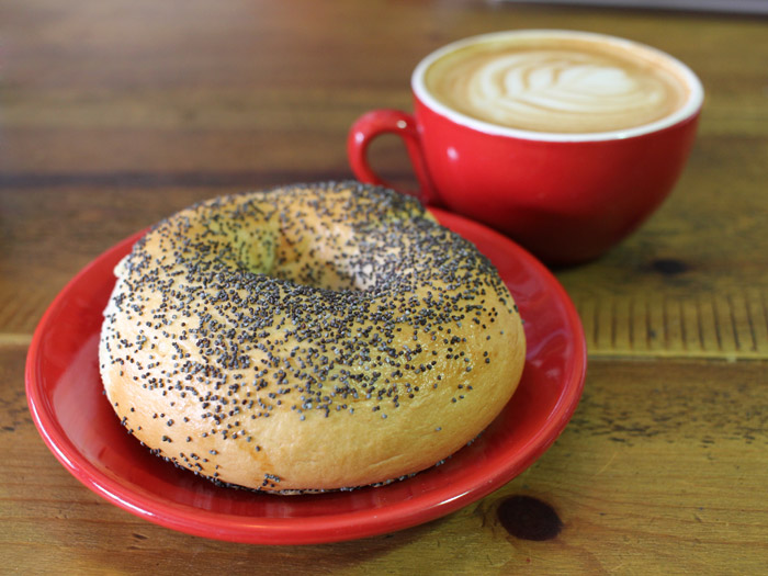 Poppy seed bagel and a cup of coffee.