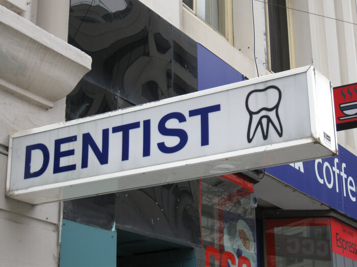 An extracted healthy tooth dental emblem.